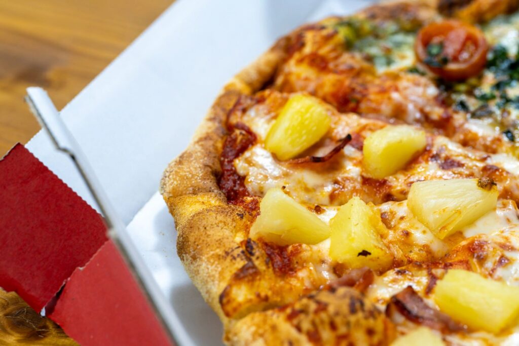 Close-Up of Half and Half Tropical and Margherita Pizza