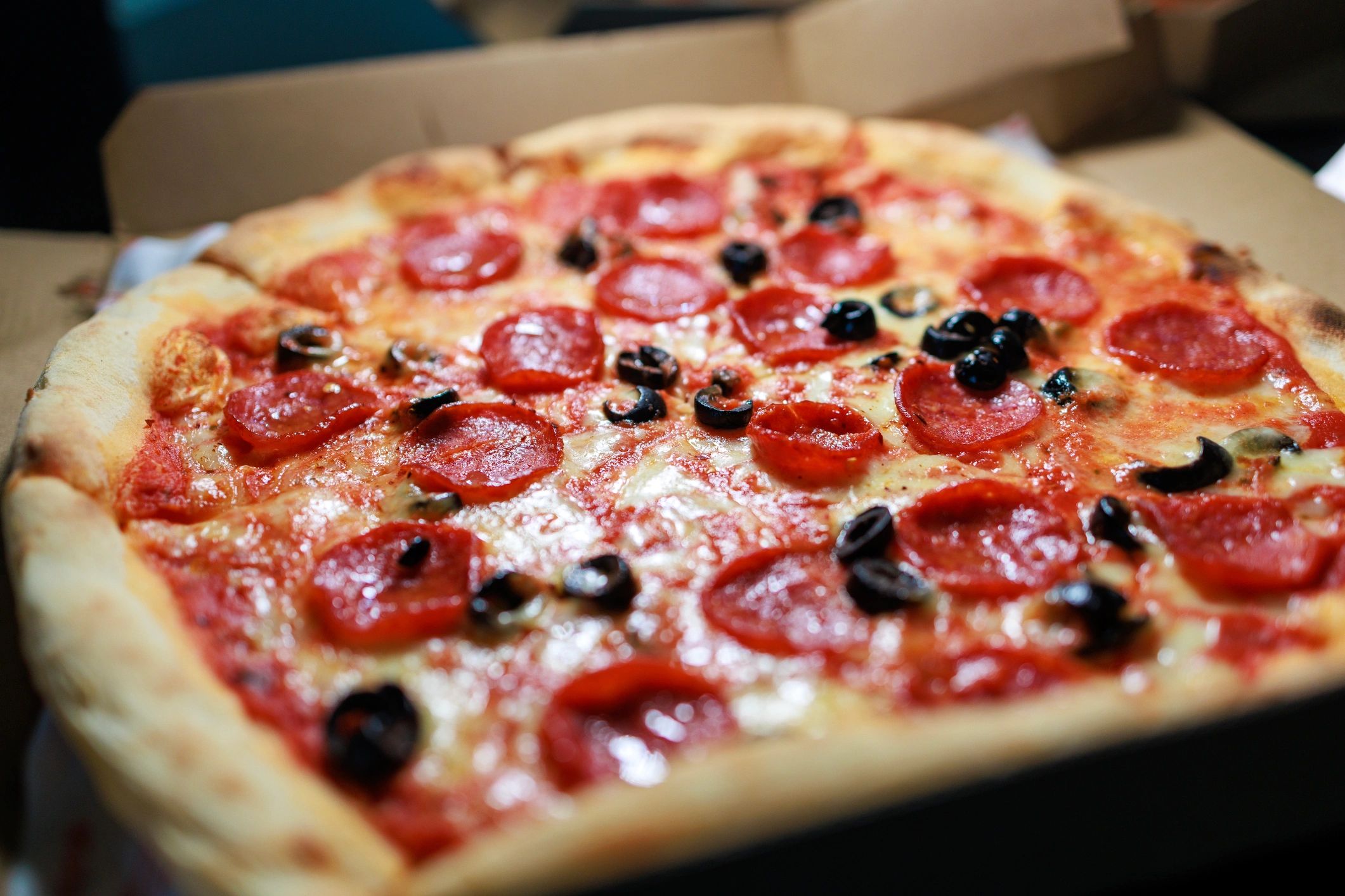 Pepperoni and olive pizza close up
